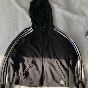 An Adidas black hoodie.